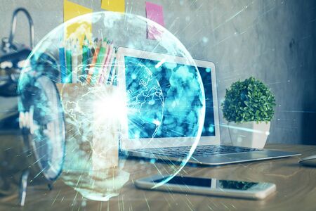 Double exposure of business theme icons and work space with computer background. Concept of success.の写真素材