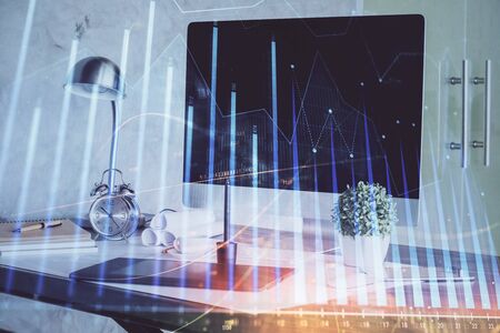 Stock market graph and table with computer background. Double exposure. Concept of financial analysis.の写真素材
