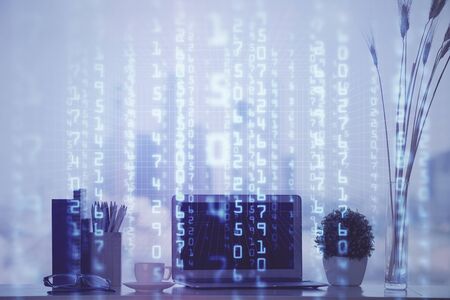 Double exposure of table with computer on background and data theme hologram. Data technology concept.の写真素材