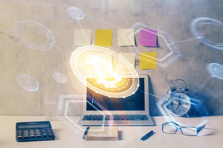 Double exposure of blockchain and crypto economy theme hologram and table with computer background. Concept of bitcoin cryptocurrency.の写真素材