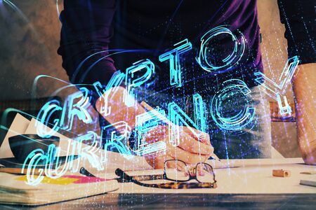 Mans hands working with notes background. Cryptocurrency and finance concept.の写真素材