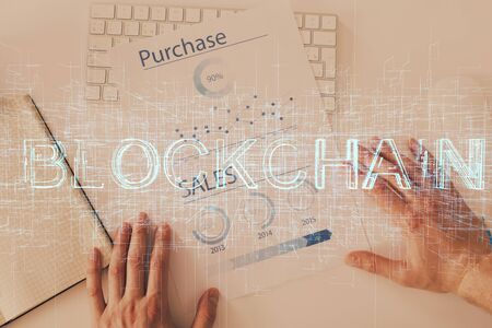 Mans hands working with notes background. Cryptocurrency and finance concept.の写真素材