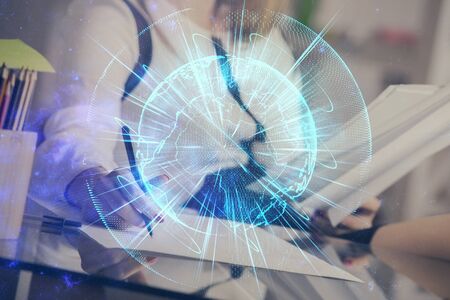 International business hologram over hands taking notes background. Concept of success. Multi exposureの写真素材