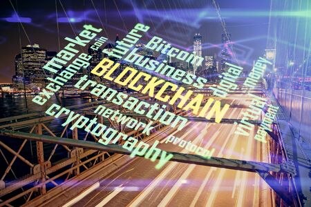Multi exposure of cryptocurrency theme hologram drawing and city veiw background. Concept of blockchain and bitcoin.の写真素材