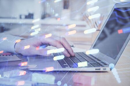 Businessman working on Laptop with technology theme drawing. Concept of big data. Double exposure.の写真素材