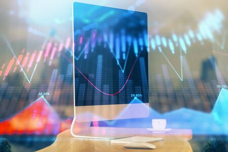 Financial market graph hologram and personal computer on background. Double exposure. Concept of forex.の写真素材