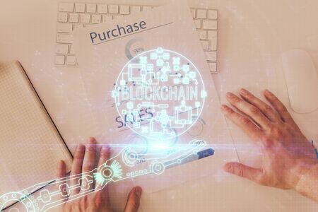 Mans hands working with notes background. Cryptocurrency and finance concept.の写真素材