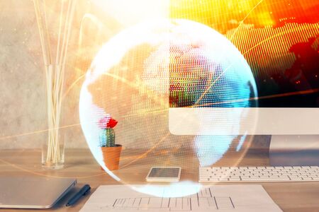 Double exposure of business theme icons and work space with computer background. Concept of success.の写真素材