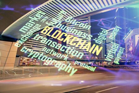 Multi exposure of cryptocurrency theme hologram drawing and city veiw background. Concept of blockchain and bitcoin.の写真素材