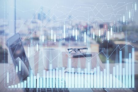 Double exposure of forex chart and work space with computer. Concept of international online...