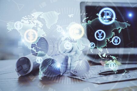Forex market chart hologram and personal computer background. Double exposure. Concept of investment.の写真素材