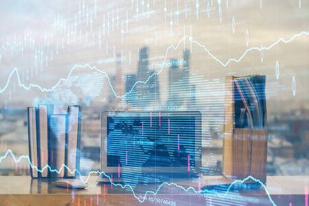Stock market graph and table with computer background. Multi exposure. Concept of financial analysis.の写真素材