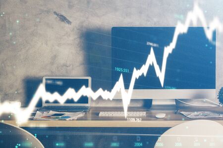 Double exposure of forex chart and work space with computer. Concept of international online...