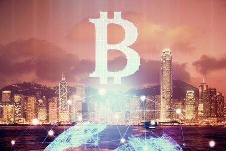 Multi exposure of cryptocurrency theme hologram drawing and city veiw background. Concept of blockchain and bitcoin.の写真素材