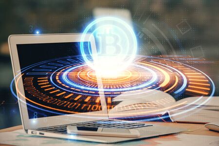 Double exposure of blockchain and crypto economy theme hologram and table with computer background. Concept of bitcoin cryptocurrency.の写真素材