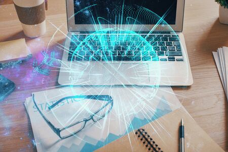 Double exposure of business theme icons and work space with computer background. Concept of success.の写真素材