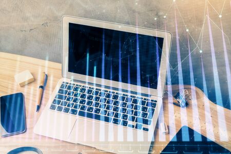 Multi exposure of graph and financial info and work space with computer background. Concept of international online trading.の写真素材