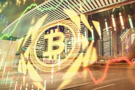 Multi exposure of cryptocurrency theme hologram drawing and city veiw background. Concept of blockchain and bitcoin.の写真素材