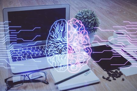 Double exposure of desktop with computer and brain drawing hologram. Artificial intelligence concept.の写真素材