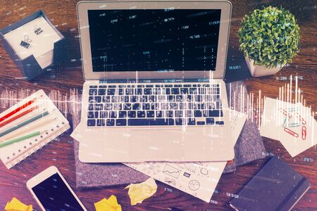 Multi exposure of chart and financial info and work space with computer background. Concept of international online trading.の写真素材