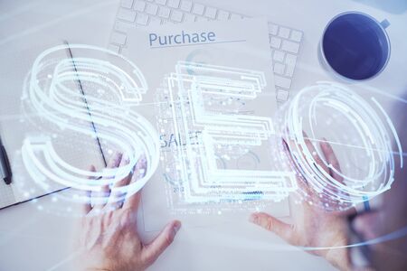 Man writing. With double exposure seo drawings.の写真素材