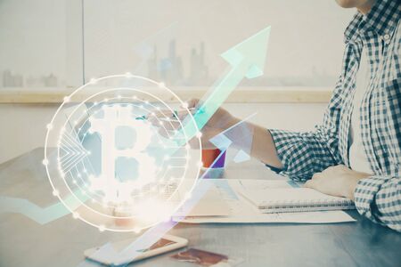 Blockchain theme hud with man working on computer on background. Concept of crypto chain. Double exposure.の写真素材