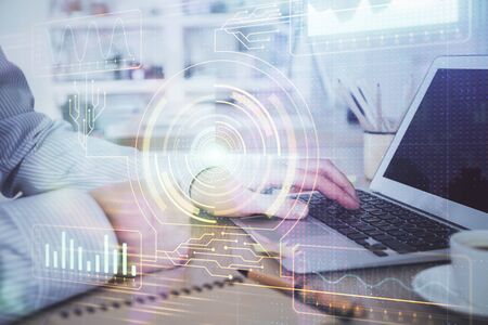 Businessman working on Laptop with technology theme drawing. Concept of big data. Double exposure.の写真素材