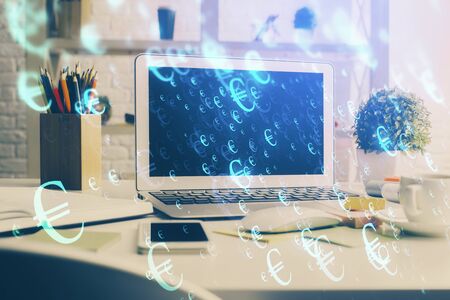 Stock market chart hologram drawn on personal computer background. Double exposure. Concept of investment.の写真素材