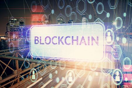Multi exposure of cryptocurrency theme hologram drawing and city veiw background. Concept of blockchain and bitcoin.の写真素材