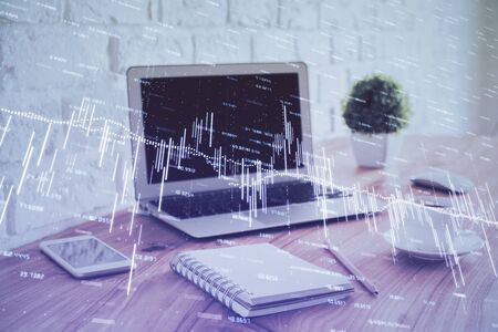 Stock market graph and table with computer background. Multi exposure. Concept of financial analysis.の写真素材