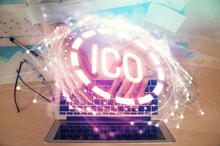 Blockchain theme hud with man working on computer on background. Concept of crypto chain. Double exposure.の写真素材