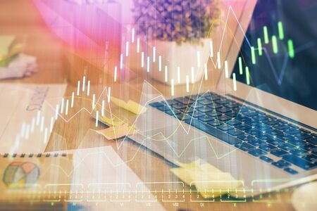 Multi exposure of chart and financial info and work space with computer background. Concept of international online trading.の写真素材