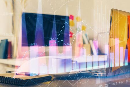 Forex market graph hologram and personal computer on background. Multi exposure. Concept of...