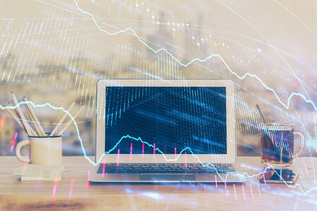 Stock market graph and table with computer background. Multi exposure. Concept of financial analysis.の写真素材