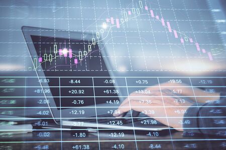 Double exposure of businessmans hands withcup of coffee with stock market graph background. Concept of research and trading.の写真素材