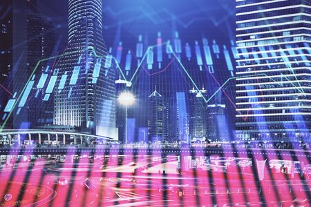 Financial chart on city scape with tall buildings background multi exposure. Analysis concept.の写真素材