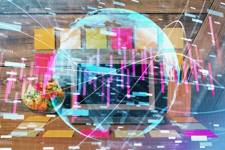 Double exposure of forex graph and work space with computer. Concept of international online trading.の写真素材