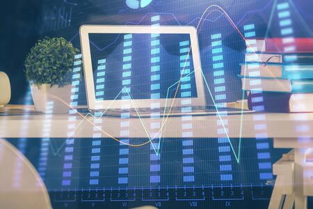 Double exposure of forex chart and work space with computer.の写真素材