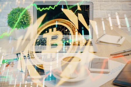 Double exposure of blockchain and crypto economy theme hologram and table with computer background. Concept of bitcoin cryptocurrency.の写真素材