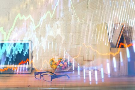 Financial chart drawing and table with computerの写真素材