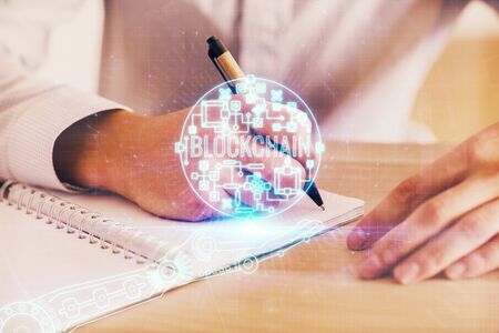 Man writing with technology icons.の写真素材