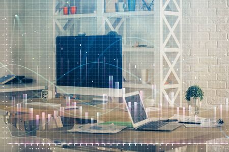 Financial graph colorful drawing and table with computerの写真素材