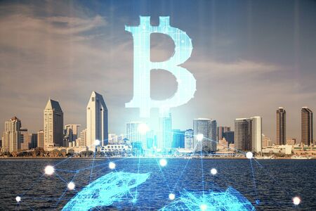 Double exposure of crypto currency theme hologram drawing and city veiw background. Concept of blockchain and bitcoin.の写真素材