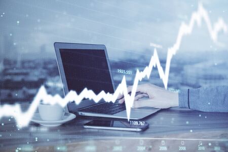 Double exposure of hands and notepad with business icons. Concept of international business.