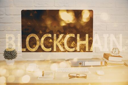 Double exposure of blockchain and crypto economy theme hologram and table with computer background. Concept of bitcoin cryptocurrency.の写真素材