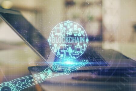 Double exposure of blockchain and crypto economy theme hologram and table with computer background. Concept of bitcoin cryptocurrency.の写真素材