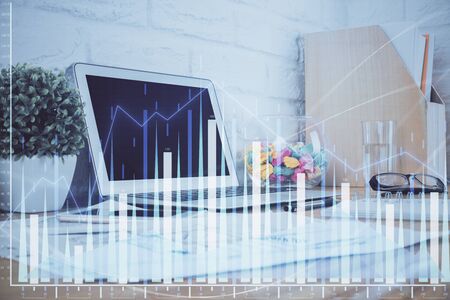 Forex market chart hologram and personal computer background. Double exposure. Concept of investment.の写真素材