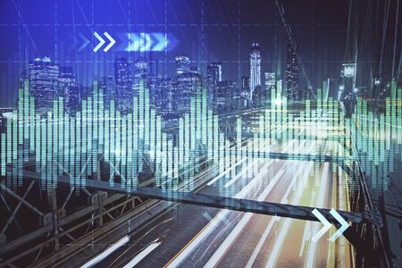 Forex chart on cityscape with tall buildings background multi exposure. Financial research concept.の写真素材