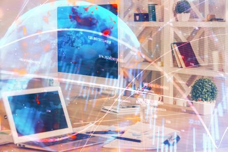 Double exposure of forex chart and work space with computer. Concept of international online trading.の写真素材