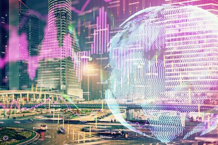 Financial chart on city scape with tall buildings background multi exposure. Analysis concept.の写真素材